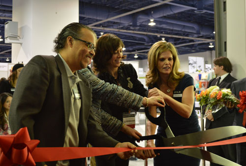 USTR's Gail Strickler cuts the ribbon at the Sourcing Hall.